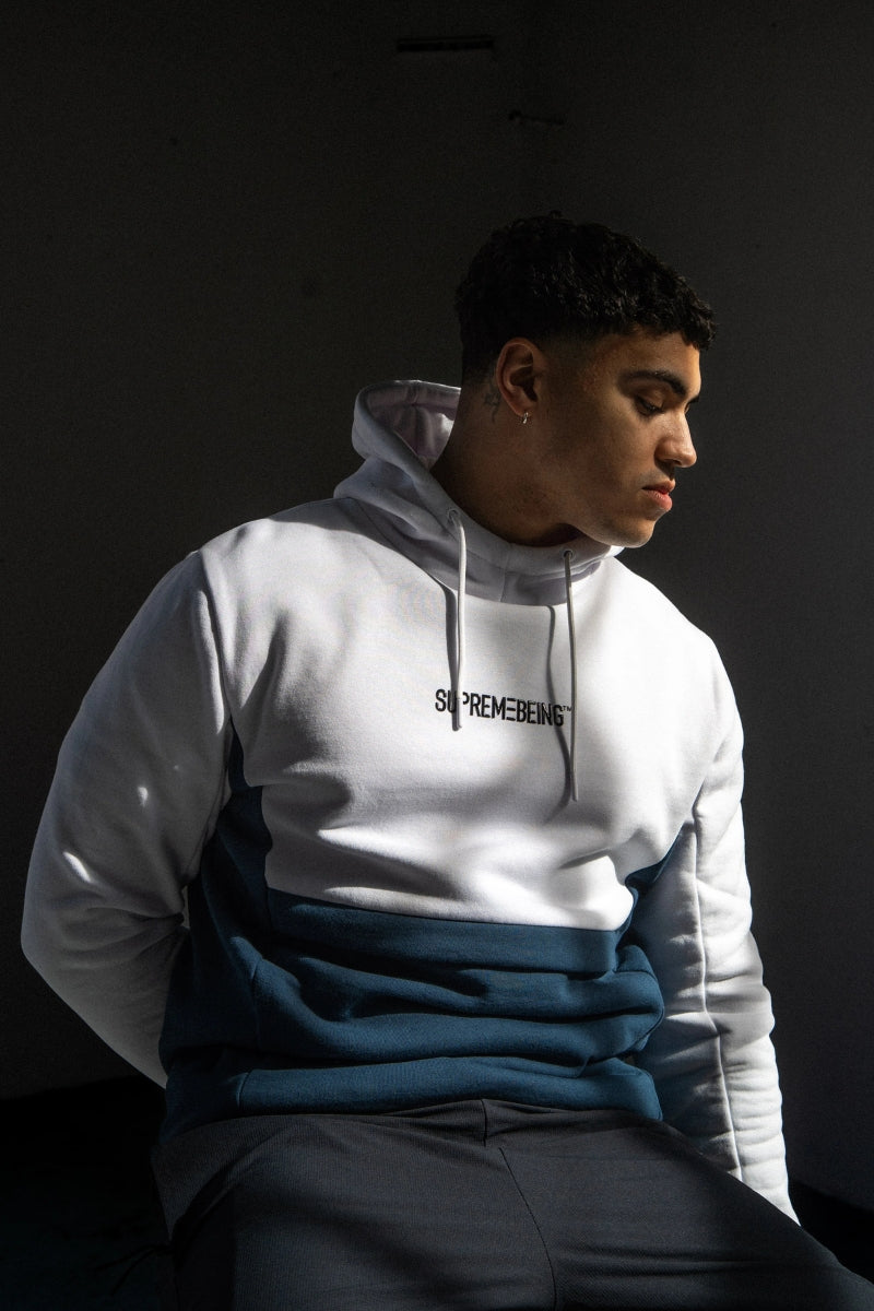 Streetwear block colour hoodie in white / Azure teal. Contrast branding on chest & logo on sleeve.